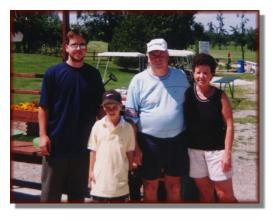 Andy golfing with his family - 1998